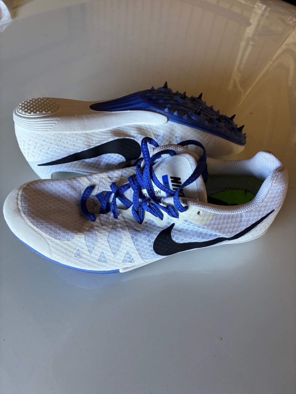 Nike White Track and Field Shoes with spikes. Blue Laces and Neon Green Insole